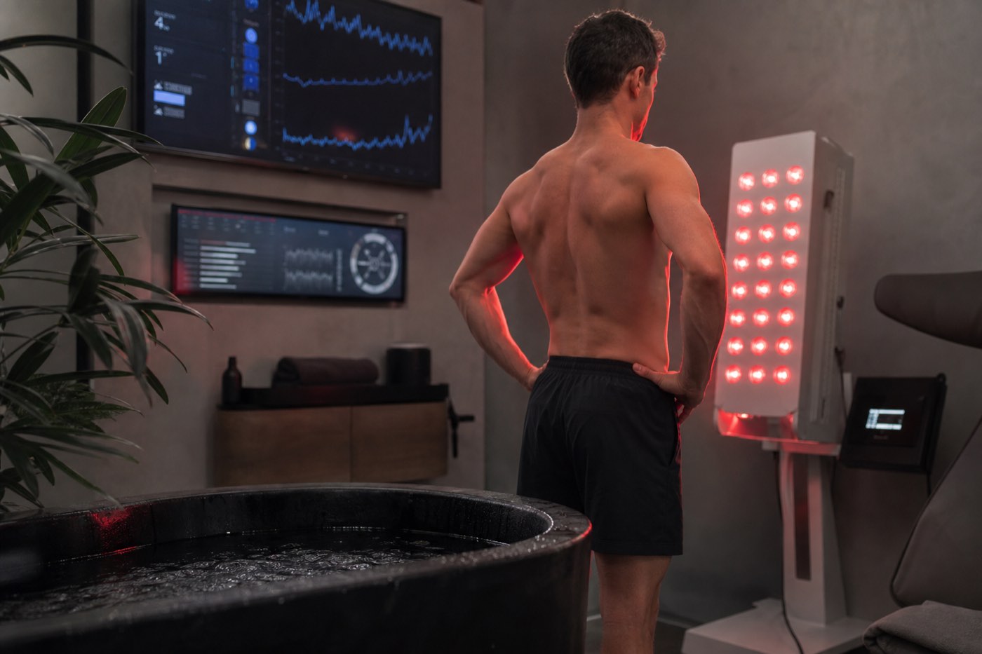 A bright, clinical room of measurement, a single figure mid-discipline surrounded by data.