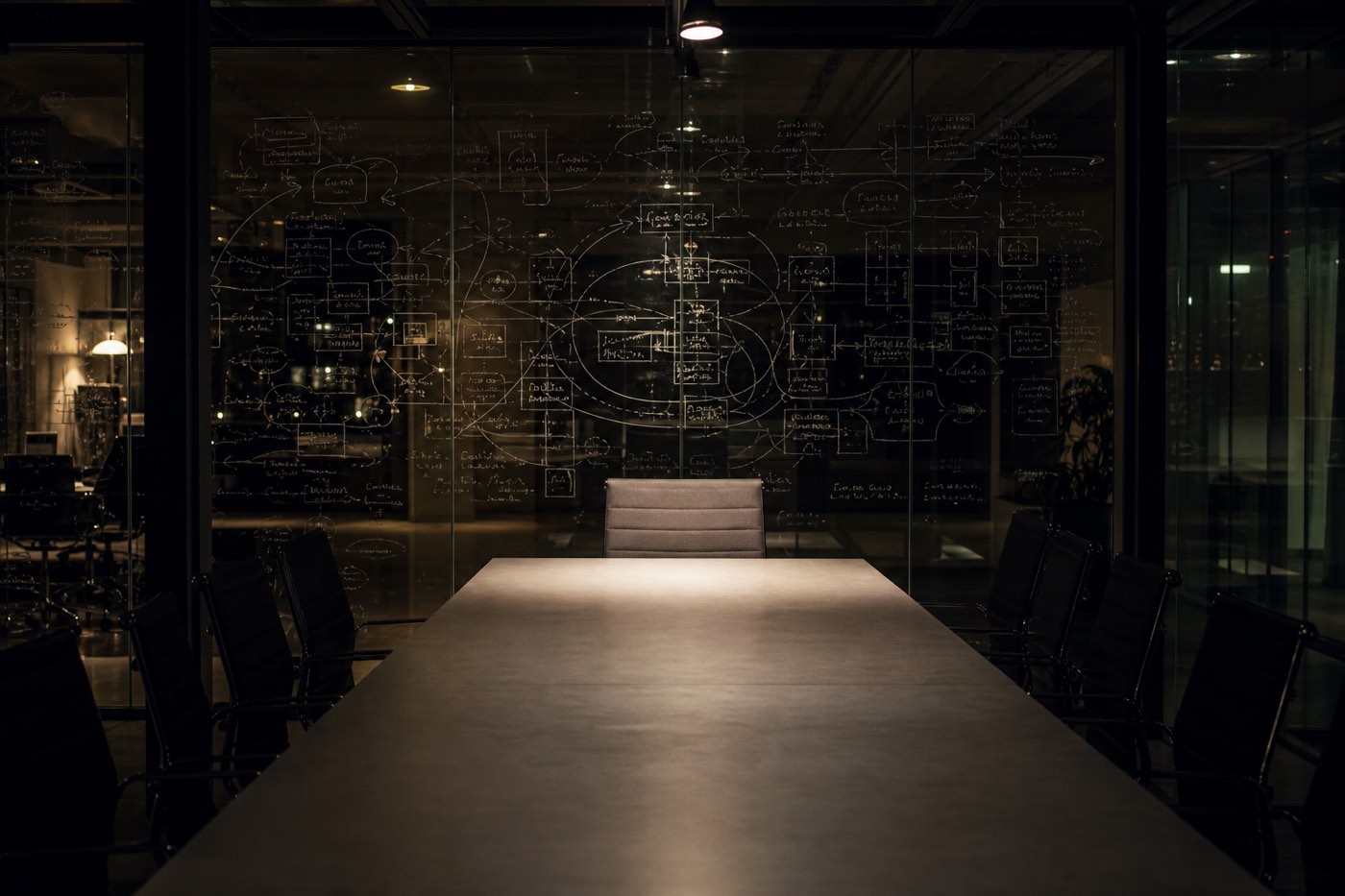 A lecture-hall wall covered in interlocking diagrams of the mind and of civilization.